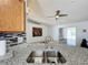 Open kitchen view featuring granite countertops at 1469 Swan Pl, Kissimmee, FL 34759