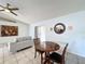 Bright living room with tile floors open to dining and kitchen areas at 1469 Swan Pl, Kissimmee, FL 34759