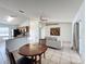 Open living room and kitchen with light tile floors at 1469 Swan Pl, Kissimmee, FL 34759