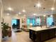Open floor plan featuring an island kitchen that looks out into a living and dining space at 1664 Andover Ridge Dr, Deland, FL 32720