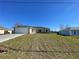Newly constructed one-story home with a spacious front yard and attached garage at 199 Juniper Way, Ocala, FL 34472