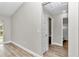 Bright hallway with wood-look floors and access to other rooms at 199 Juniper Way, Ocala, FL 34472
