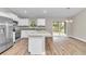 Modern kitchen featuring granite countertops and white shaker cabinets at 199 Juniper Way, Ocala, FL 34472