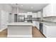 Spacious kitchen with island, stainless steel appliances, and granite countertops at 199 Juniper Way, Ocala, FL 34472