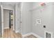 Bright laundry room featuring built-in shelving and vinyl flooring at 199 Juniper Way, Ocala, FL 34472