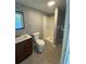 Bathroom featuring a single sink vanity and a glass-enclosed shower at 2302 E Dana Dr, Deltona, FL 32738