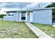 Charming single-story home with a well-maintained lawn and inviting entrance at 2302 E Dana Dr, Deltona, FL 32738