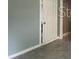 Hallway with neutral paint and tile floors at 2302 E Dana Dr, Deltona, FL 32738