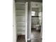 Open shelving provides ample storage next to a bathroom with tub at 2302 E Dana Dr, Deltona, FL 32738