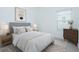 Neutral bedroom with large window, stylish rug, and calming decor at 473 Disa Dr, Davenport, FL 33837