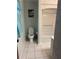 Tiled bathroom featuring a toilet, shower, and vanity with ample lighting at 11 Sandra Cir, New Smyrna Beach, FL 32168