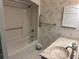 Bathroom with a shower, tub, grab bars, and a vanity with a unique stone sink at 11 Sandra Cir, New Smyrna Beach, FL 32168