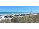 Scenic view of cars parked along the beach, with people enjoying the sand and surf on a sunny day at 11 Sandra Cir, New Smyrna Beach, FL 32168