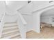 Modern light-colored staircase leading to upper level at 1517 E Esther St, Orlando, FL 32806