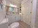 Bright bathroom featuring a double sink vanity with white cabinets, modern fixtures, and framed mirror at 3258 Cranston St, Deltona, FL 32738