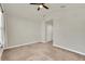 Spacious bedroom with double doors and carpet at 3780 Plainview Dr, Orlando, FL 32824