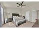 Bright bedroom with a queen-size bed and built-in shelving at 3780 Plainview Dr, Orlando, FL 32824