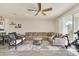 Living area with comfortable seating, large windows, and exercise bike at 3780 Plainview Dr, Orlando, FL 32824