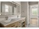 Modern bathroom with double vanity and large mirror at 531 Sanctuary Golf Pl, Apopka, FL 32712