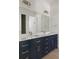 Modern bathroom with double vanity and walk-in shower at 531 Sanctuary Golf Pl, Apopka, FL 32712