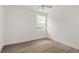 Bright bedroom with wood-look floors and ceiling fan at 531 Sanctuary Golf Pl, Apopka, FL 32712