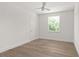 Spacious bedroom featuring wood-look floors and a ceiling fan at 531 Sanctuary Golf Pl, Apopka, FL 32712