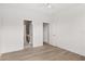 Spacious bedroom with wood-look floors and access to bathroom at 531 Sanctuary Golf Pl, Apopka, FL 32712