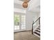 Elegant entryway with double doors and staircase at 531 Sanctuary Golf Pl, Apopka, FL 32712