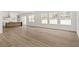 Bright living room with hardwood floors and large windows at 531 Sanctuary Golf Pl, Apopka, FL 32712
