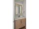 Modern powder room with wood vanity and tile at 531 Sanctuary Golf Pl, Apopka, FL 32712