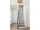 Modern staircase with dark wood railings at 531 Sanctuary Golf Pl, Apopka, FL 32712