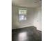 Bedroom with tile flooring, a window, and neutral walls, creating a calming and adaptable space at 766 Carlson Dr, Orlando, FL 32804