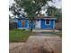 Exterior of a blue single-story home with a front porch, showcasing its simple and inviting design at 766 Carlson Dr, Orlando, FL 32804