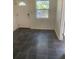 Inviting foyer features sleek tile flooring, natural light from the window, and a white front door at 766 Carlson Dr, Orlando, FL 32804