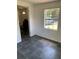 Bright living room with tiled floors and a large window, creating a comfortable and airy space at 766 Carlson Dr, Orlando, FL 32804