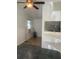 Open-concept living room with ceiling fan, window AC, and views to dining and kitchen spaces at 766 Carlson Dr, Orlando, FL 32804