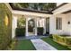 Covered patio with built-in grill and lush landscaping at 1400 Place Picardy, Winter Park, FL 32789