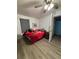 Bedroom featuring a ceiling fan, vinyl floors, and window with blinds at 5165 Gwynne Ave, Orlando, FL 32810