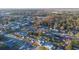 Aerial view of neighborhood with focus on house and private pool at 610 Alton Rd, Winter Springs, FL 32708