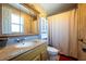 Clean bathroom with a shower/tub combo and granite vanity at 610 Alton Rd, Winter Springs, FL 32708