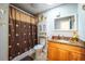Clean bathroom with a shower/tub combo and granite vanity at 610 Alton Rd, Winter Springs, FL 32708