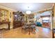 Elegant dining room features a large glass-top table and antique wooden hutch at 610 Alton Rd, Winter Springs, FL 32708