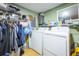 Bright laundry room with washer, dryer, and ample storage at 610 Alton Rd, Winter Springs, FL 32708