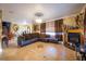 Bright living room with L-shaped sofa, fireplace, and tile flooring at 610 Alton Rd, Winter Springs, FL 32708