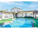 Home features a large kidney-shaped pool at 610 Alton Rd, Winter Springs, FL 32708