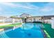 Relaxing kidney-shaped pool in the backyard at 610 Alton Rd, Winter Springs, FL 32708