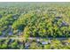 An aerial view of the lush neighborhood at 765 W Lansdowne Ave, Orange City, FL 32763
