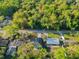 Aerial view of houses nestled among trees in the neighborhood at 765 W Lansdowne Ave, Orange City, FL 32763