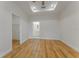 Spacious bedroom featuring wood-look floors, ensuite bathroom, and a walk-in closet at 765 W Lansdowne Ave, Orange City, FL 32763