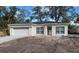 Newly constructed one-story home with attached garage and landscaping to be completed at 765 W Lansdowne Ave, Orange City, FL 32763